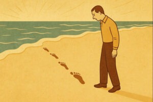 Man looks at footprints in the sand.